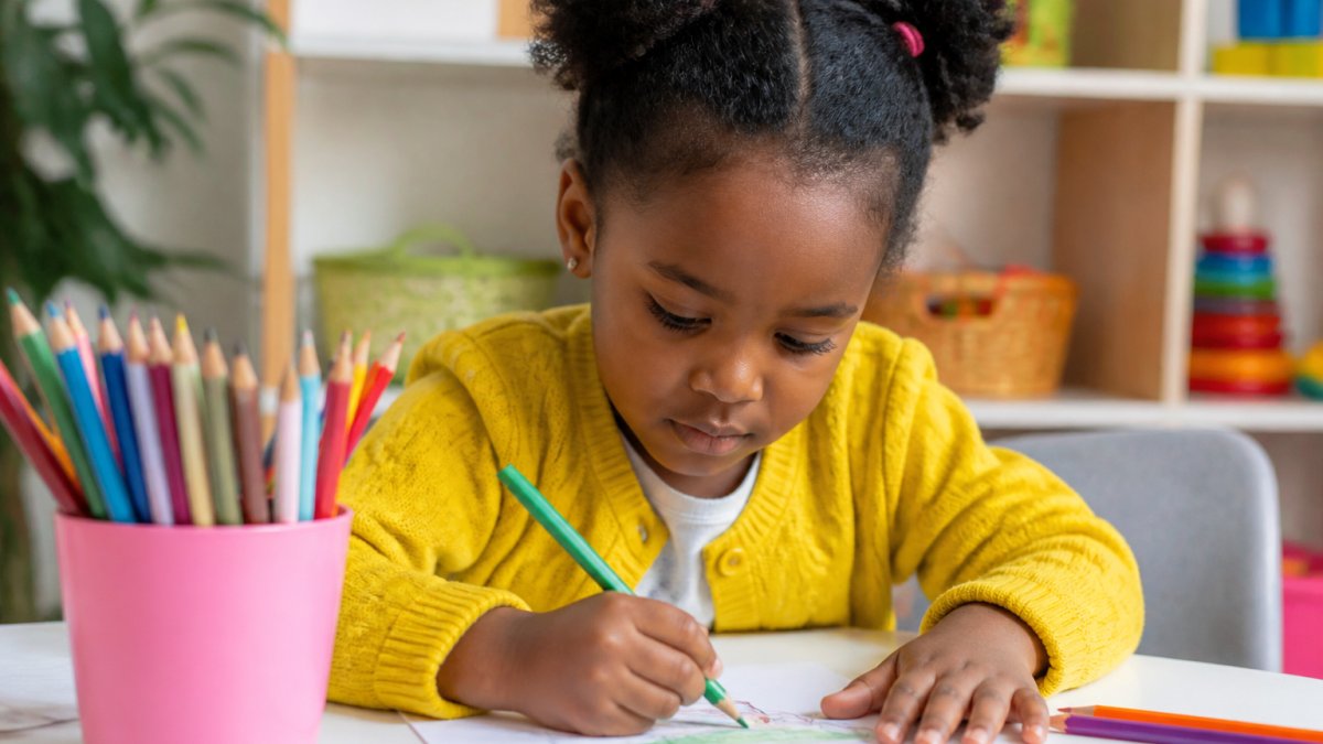 Infographic showing 10 fun school readiness activities for preschoolers through a child drawing at a table