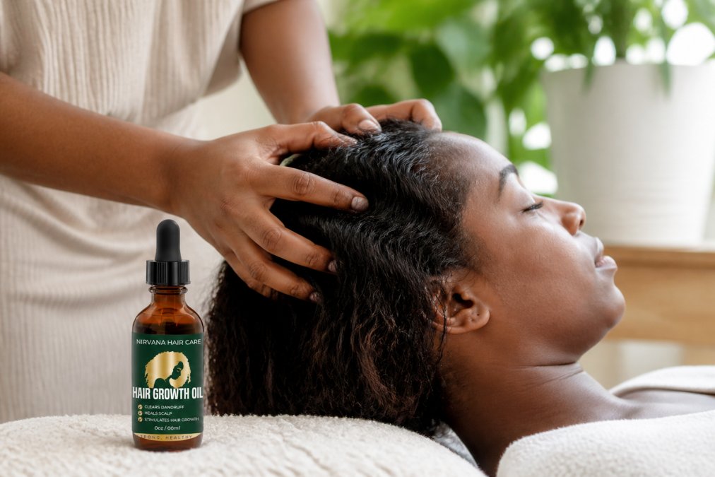 Close-up of hands gently massaging woman's scalp with fingertips during hair care routine, natural lighting showing scalp stimulation technique