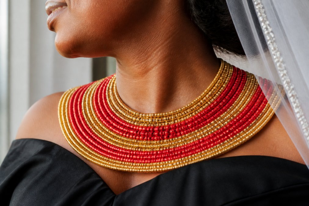 Comparison chart of 7 African beaded necklaces for bridal wear with red and gold multistrand collar detail