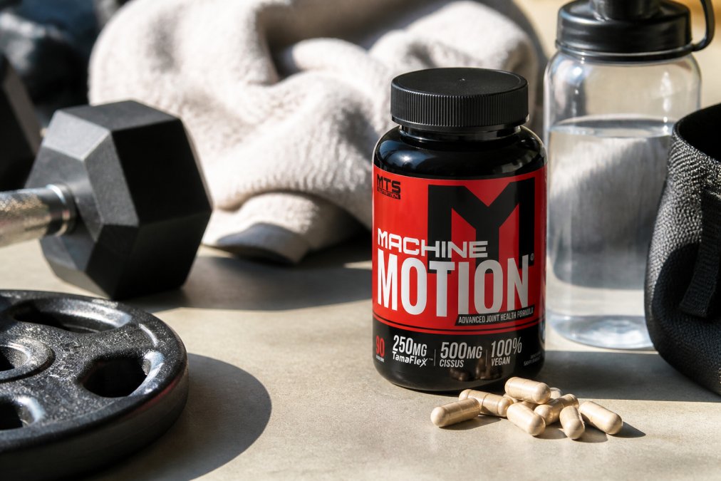 Close-up of supplement bottles and capsules arranged on a clean surface next to water bottle and workout gear, with morning sunlight streaming across the table