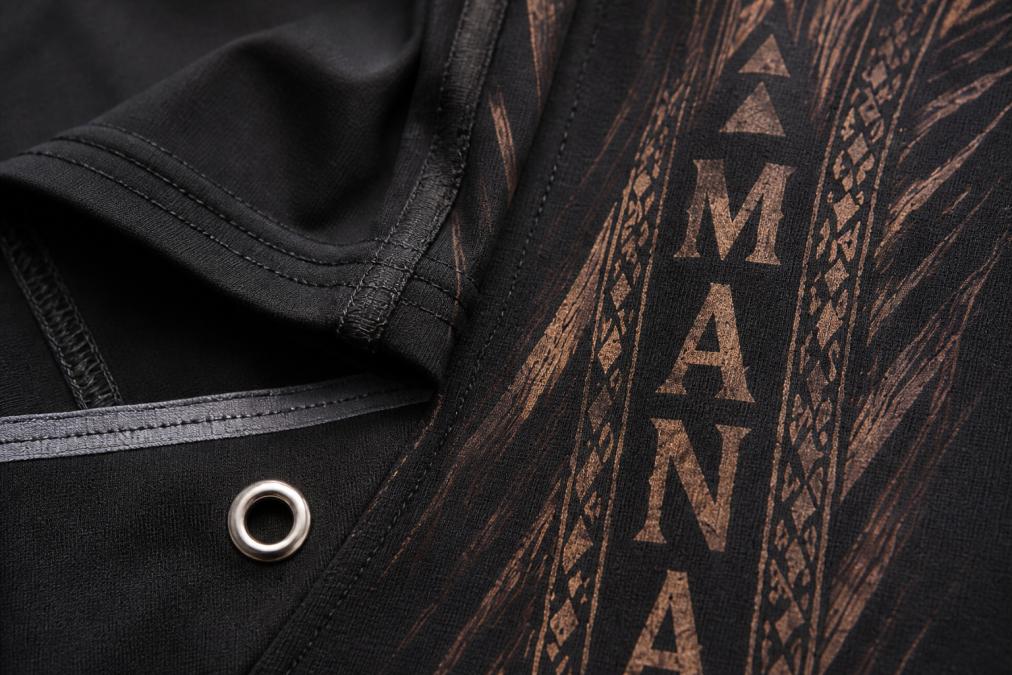 Close-up of premium nylon fabric texture showing reinforced stitching detail, seam tape, and stainless steel hardware on island-inspired apparel, natural lighting highlighting construction quality