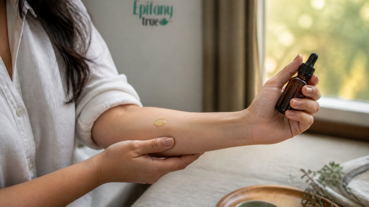 Woman applying a small patch of soothing balm to her inner forearm for a skin test