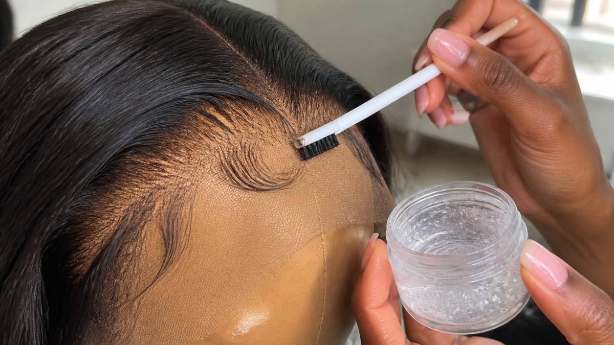 Step-by-step guide showing how to style baby hairs on a wig using clear edge control gel and a fine-tooth brush.