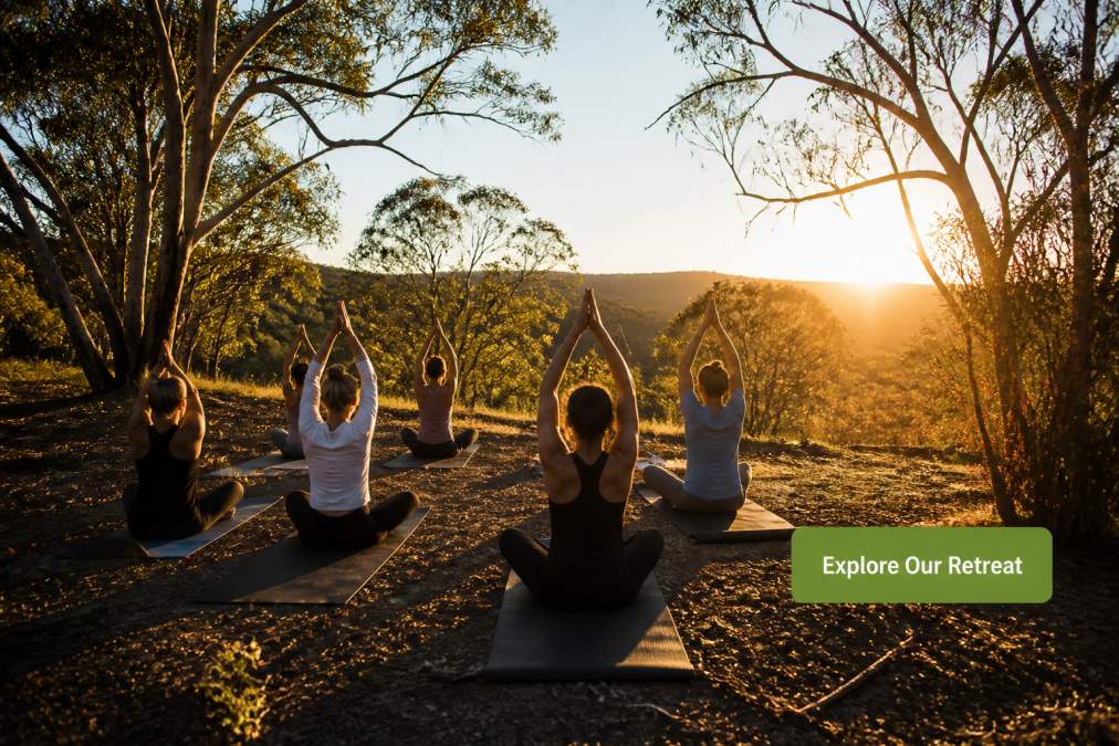 A serene outdoor yoga session at sunrise in the Australian bush, with a small group of people on mats surrounded by eucalyptus trees