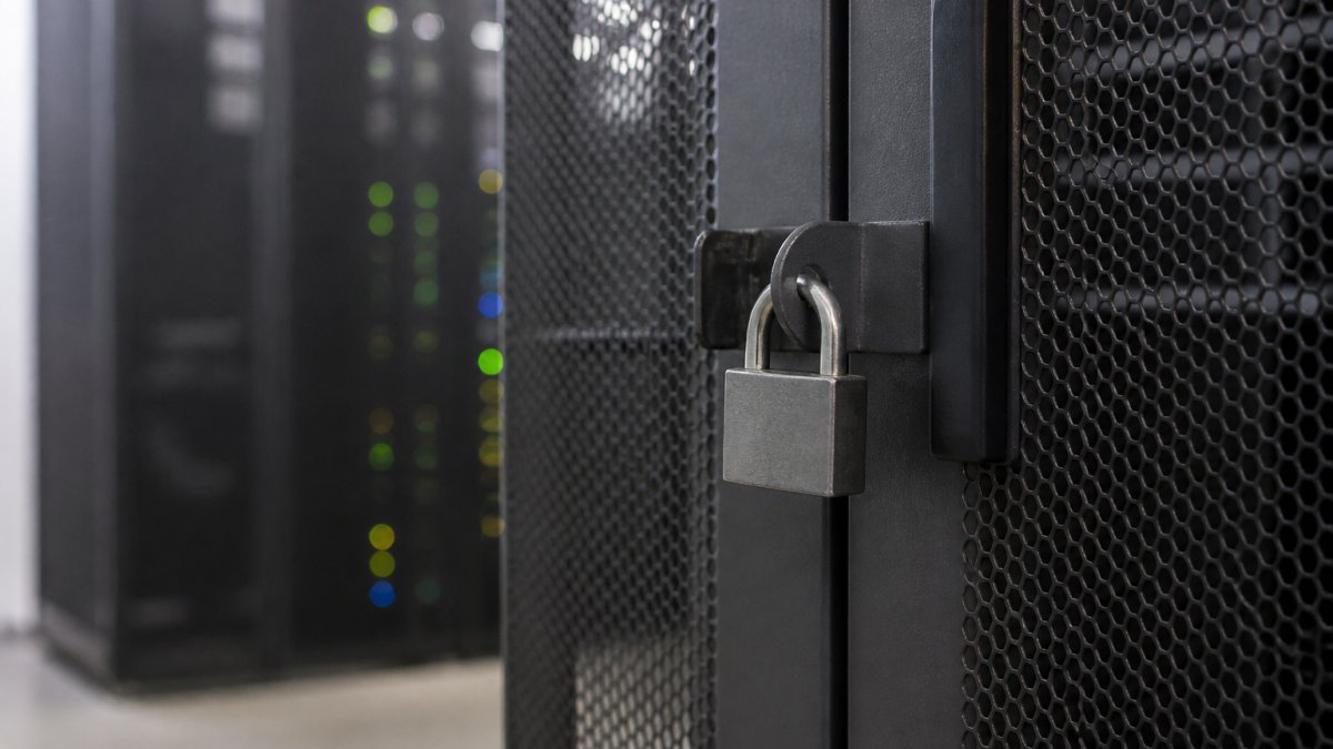 Security operations center team monitoring multiple screens displaying real-time threat alerts, network activity dashboards, and incident investigation tools in a modern data center environment with professional lighting and collaborative workspace setup