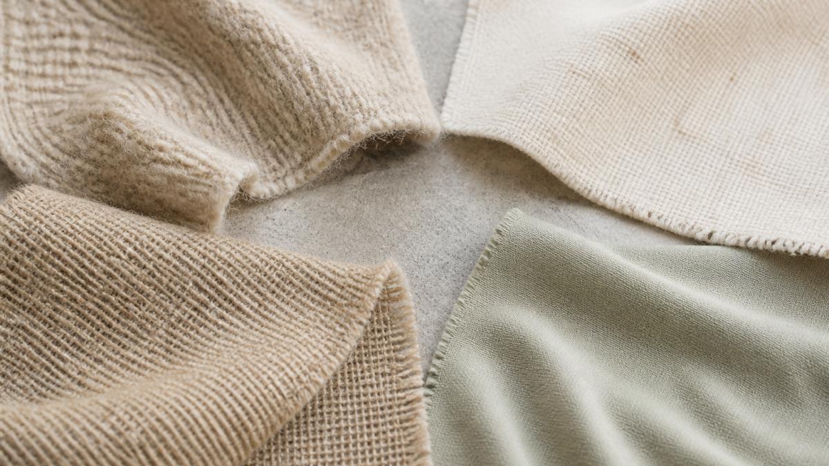 Comparison of fabric textures as natural alternatives to synthetic activewear: merino, cotton, hemp, and bamboo.