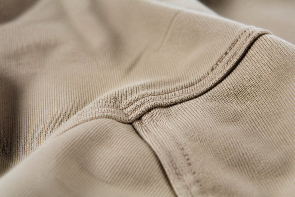Close-up of quality fabric texture and stitching on a faith-inspired shirt, showing attention to detail and craftsmanship