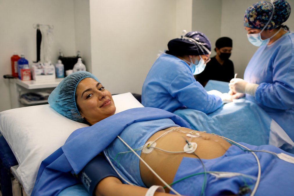 Patient remains calm and alert during awake abdominoplasty vs traditional tummy tuck procedure under local anesthesia.