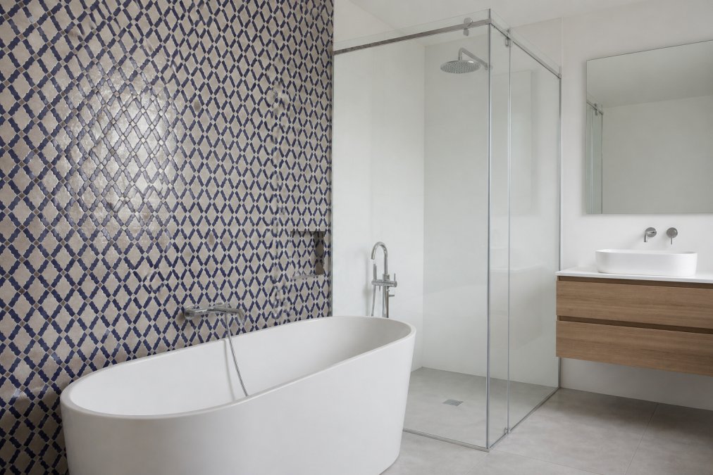 Modern bathroom with floor-to-ceiling white acrylic wall panels installed in a shower enclosure, showing seamless glossy surfaces and clean installation lines with chrome fixtures