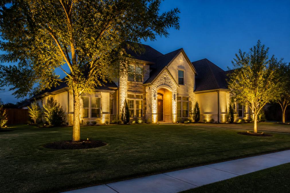 Diagram illustrating how smart outdoor lighting enhances home curb appeal and property value at dusk