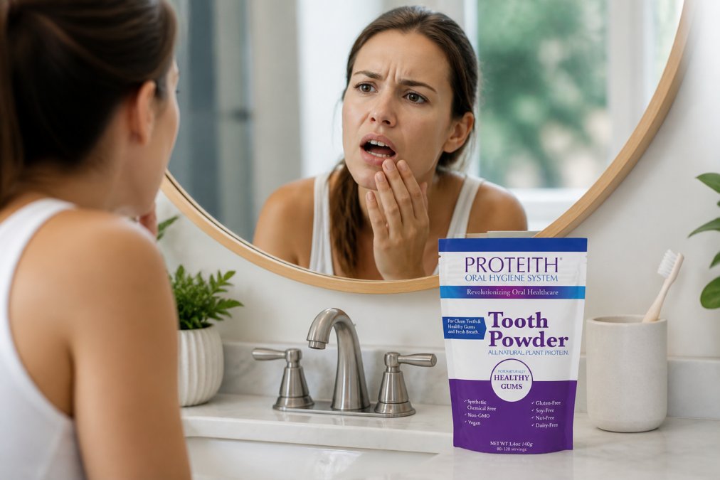Close-up of a person examining their gums in a bathroom mirror with a concerned expression, soft natural lighting