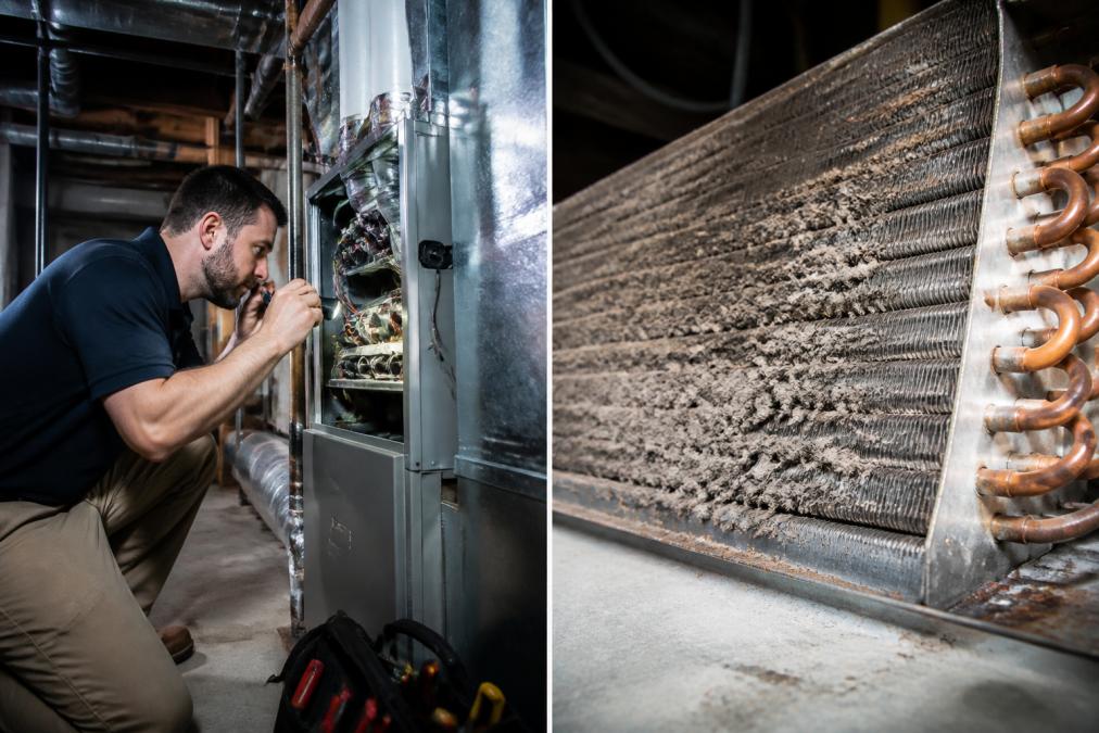 HVAC technician in work uniform carefully inspecting ductwork, coils, and internal components of air conditioning system in residential basement with flashlight and diagnostic equipment