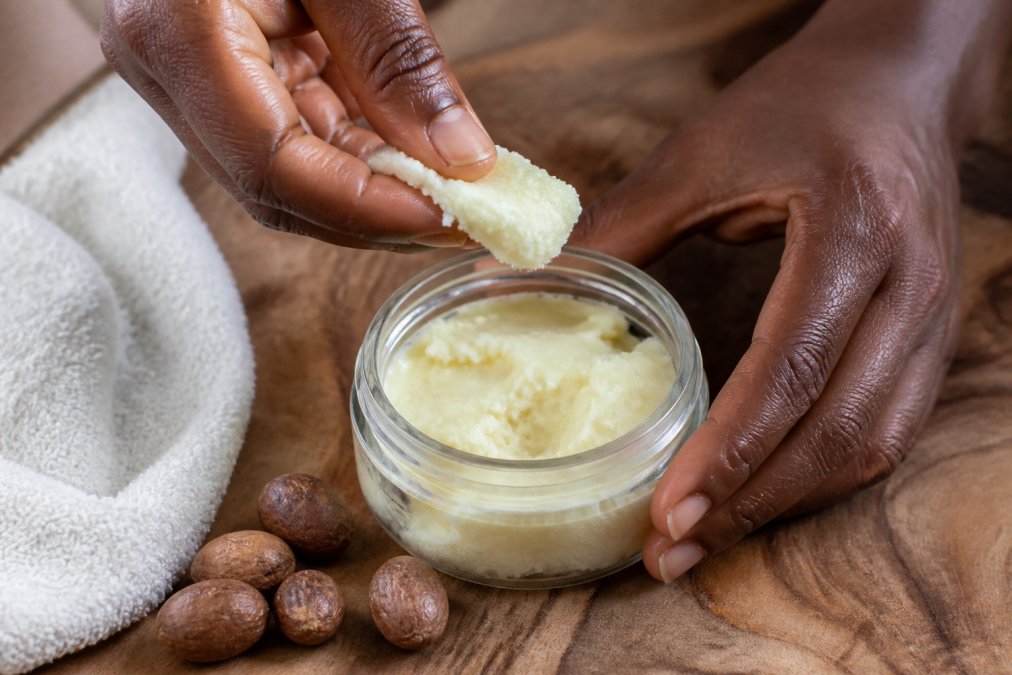 Process diagram showing how raw shea butter repairs the skin barrier and provides deep moisture to hands.