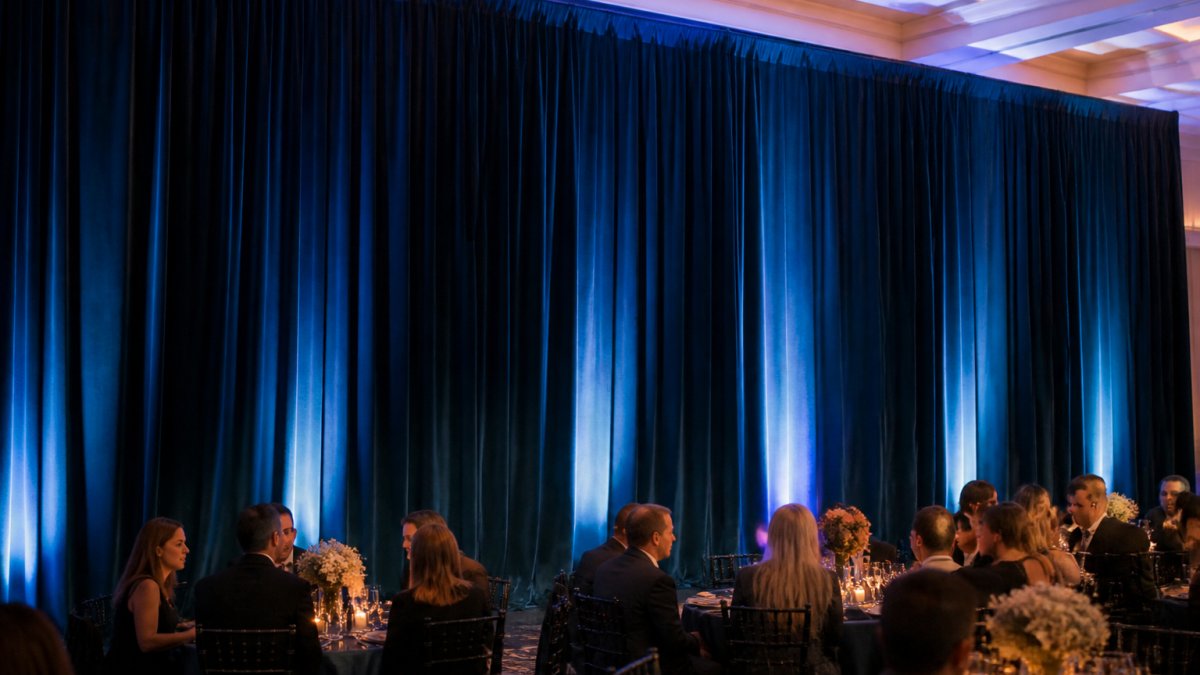 Infographic showing the wrinkle-resistance benefits of stretch velvet drapes at a formal gala event