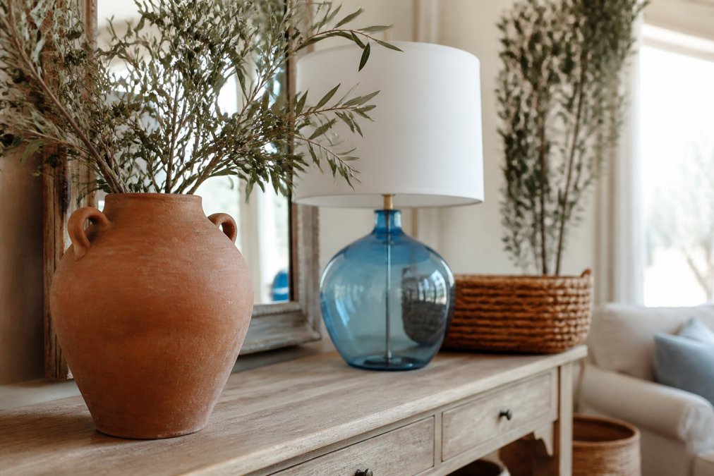 Diagram showing steps to style a Mediterranean living room corner with rustic decor and lighting elements