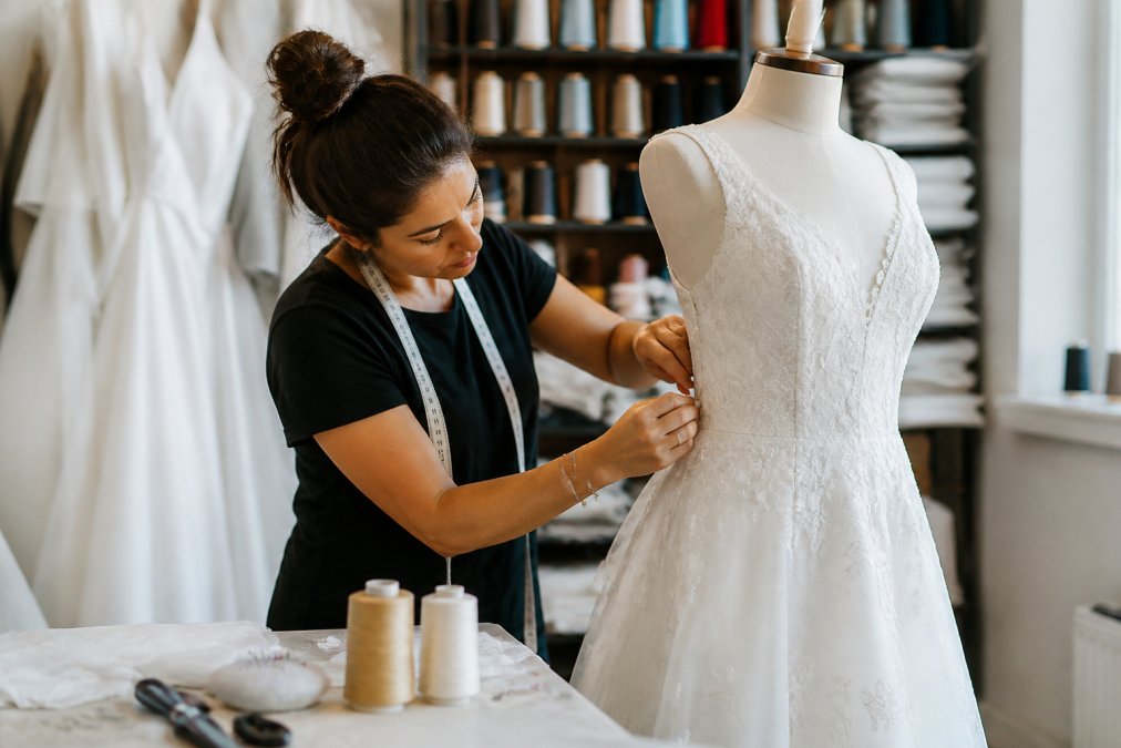 Professional illustration showing skilled and seamstress and carefully concepts for bridal alterations alternative