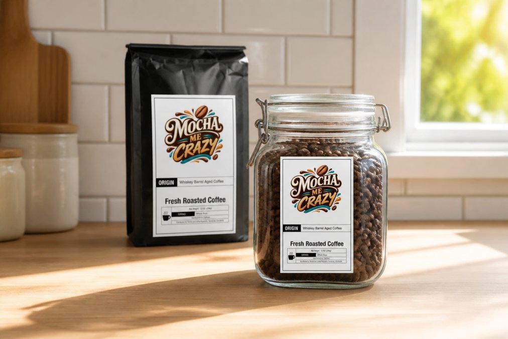 Coffee beans stored in an airtight glass container with a visible roast-date label on the container, sitting on a kitchen counter with morning sunlight filtering through a nearby window