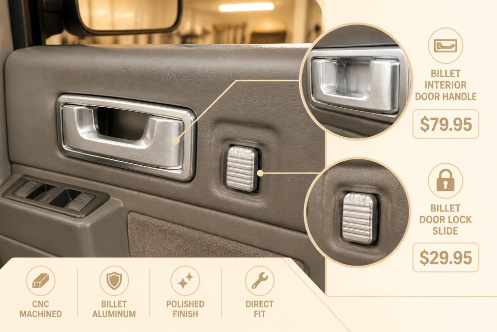 Close-up of CNC-machined billet aluminum interior door handles and door lock slides installed inside a classic OBS Chevy truck cab, showing the polished machined finish against the factory gray door panel under warm garage lighting