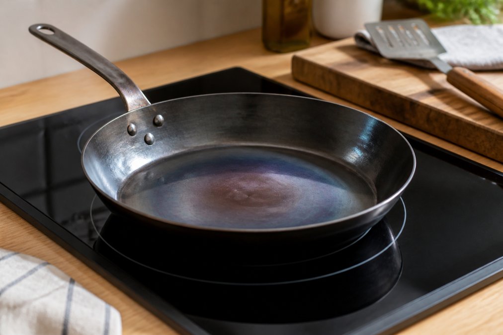 Professional illustration showing carbon steel cookware