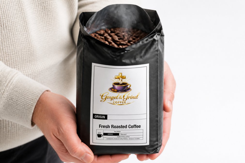 Close-up of freshly roasted coffee beans in a kraft bag with a clearly visible roast date label, steam rising from the open top, held in hands against a bright white background