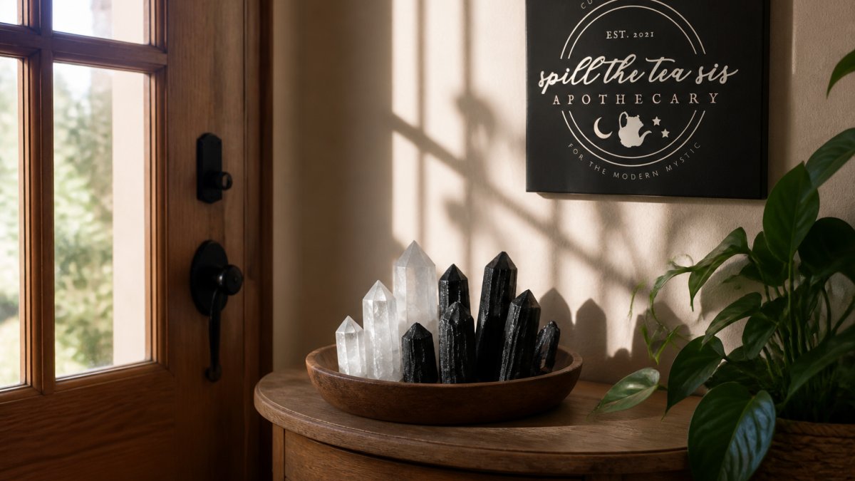 A serene home entryway with protective black tourmaline and clear quartz crystals arranged on a small wooden table near the front door, soft natural light filtering through a window, creating peaceful shadows on the wall