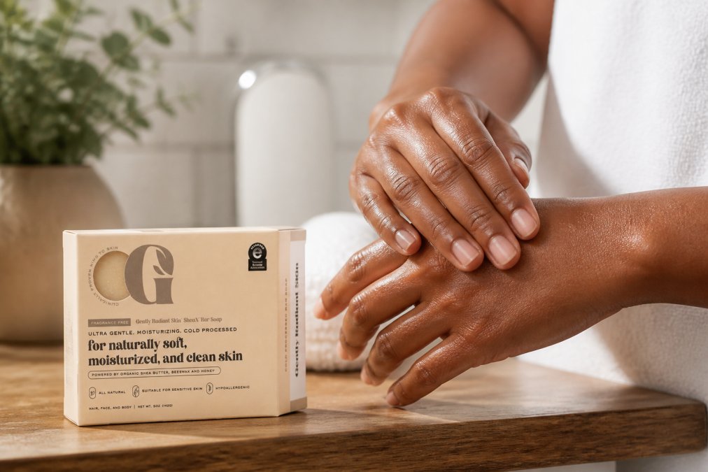 Close-up of someone's hands showing healthy, visibly moisturized skin with a natural glow after cleansing with gentle fragrance-free soap, demonstrating the results of proper barrier care