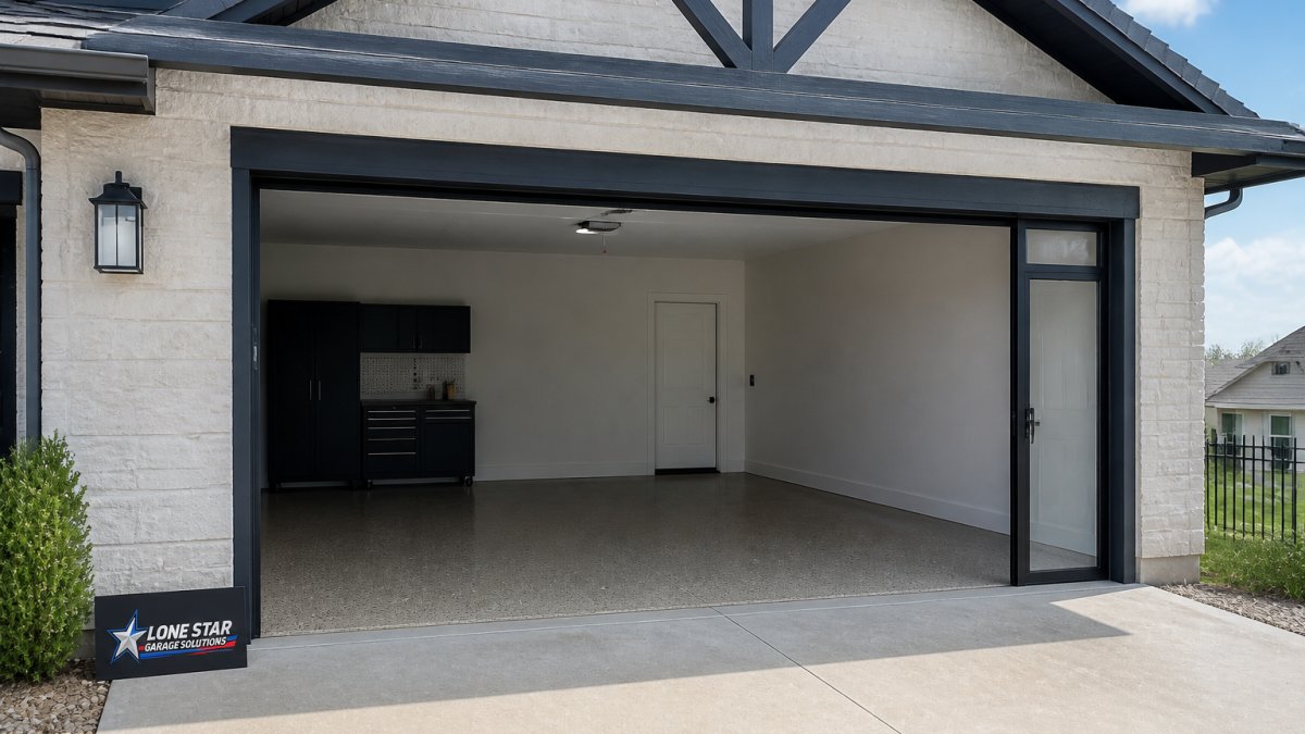 Fully retracted Lifestyle garage screen system flush with the garage opening, showing the clean aesthetic and passage door detail with a residential garage and driveway in the background