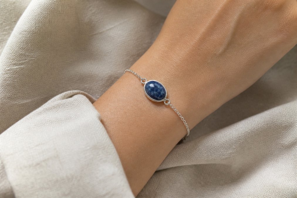 Diagram showing the hypoallergenic properties of handcrafted jewelry materials like sterling silver and sodalite.