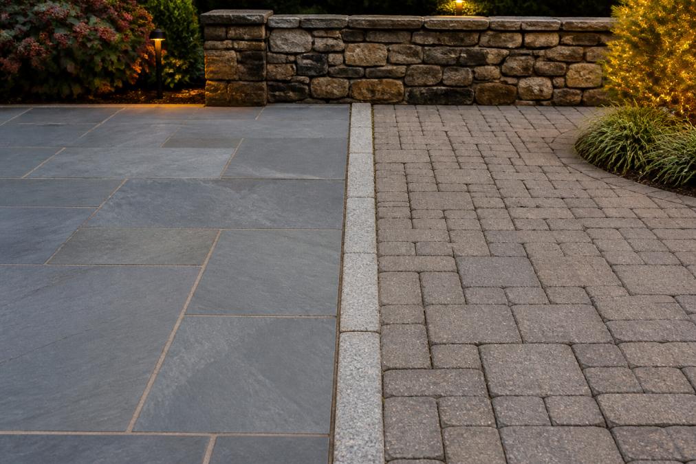 Comparison chart of hardscape materials featuring bluestone and concrete pavers in a landscaped backyard setting.