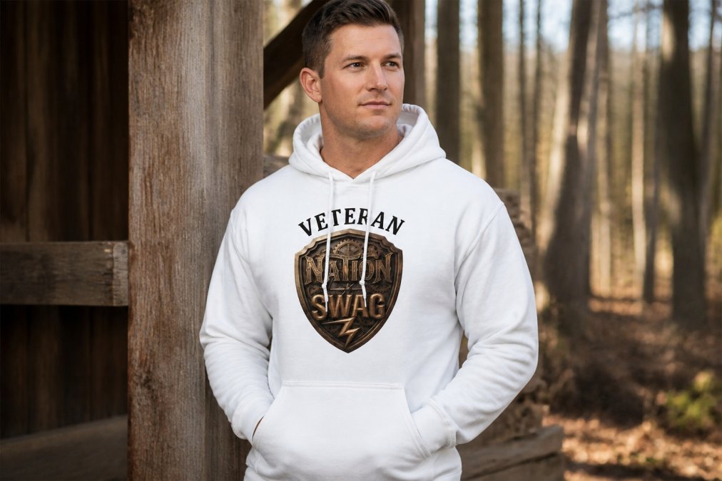 Veteran wearing the Veteran Shield Strength Hoodie with lightning bolt design standing outdoors in natural daylight, showing the graphic detail, fit, and quality of the heavy blend fabric on a real person