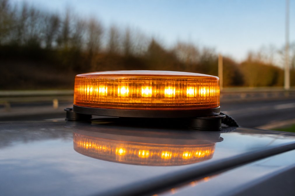 Best LED Road Safety Beacons 2026 Close-up of an amber LED beacon mounted on a vehicle roof during daylight hours, showing the magnetic base and 360-degree light distribution from multiple LED points