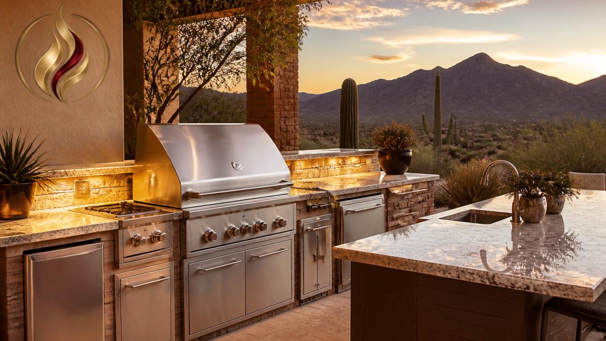 Luxury desert backyard with stainless steel built-in grill and granite countertop island, surrounded by native desert landscaping and mountain views at golden hour, warm ambient lighting illuminating the cooking surface