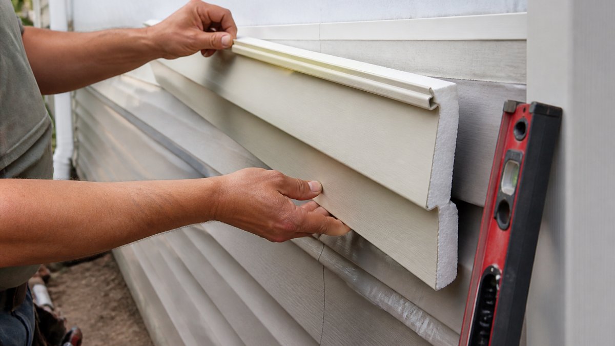 Diagram showing how foam-backed panels function as the best siding for energy efficiency during installation