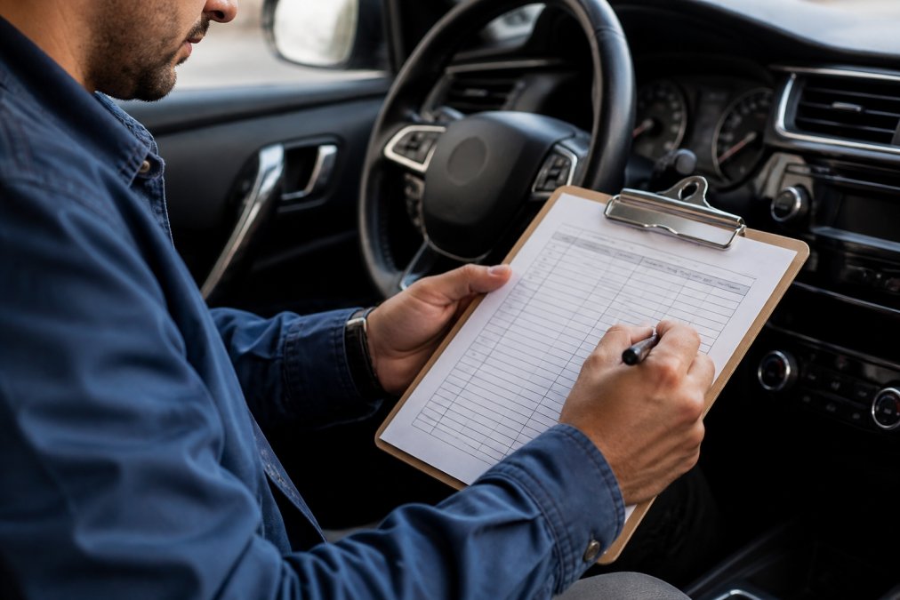 Professional demonstrating tax deductions for business vehicle maintenance technique in modern clinical setting with natural lighting