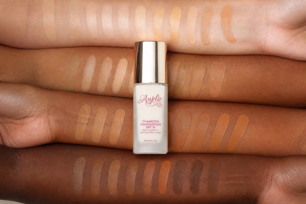 Close-up of diverse skin tones with foundation swatches showing accurate color matching and no orange undertones or oxidation across different complexions, natural daylight