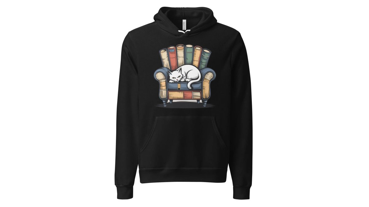 Person wearing the Cat Relaxing Premium Cotton hoodie in black, relaxing on a couch with a tabby cat nearby, showing the hoodie's comfort and fit in a home setting