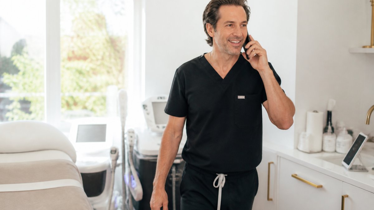 Professional demonstrating cellulite treatment near me technique in modern clinical setting with natural lighting