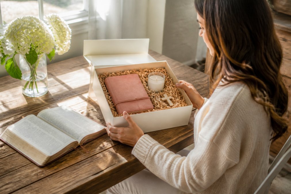 Process flowchart for choosing unique faith gifts featuring a devotional journal, candle, and Bible.