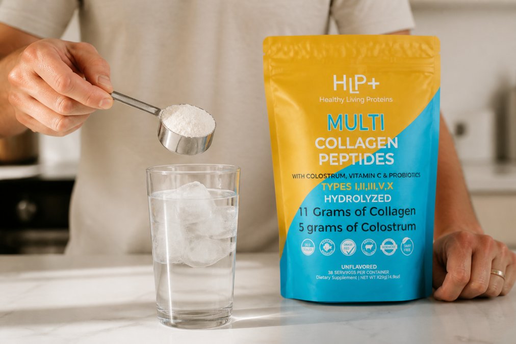 Close-up of hands holding a metal scoop of collagen powder suspended over a clear glass of water with ice, showing the moment before mixing a daily supplement routine