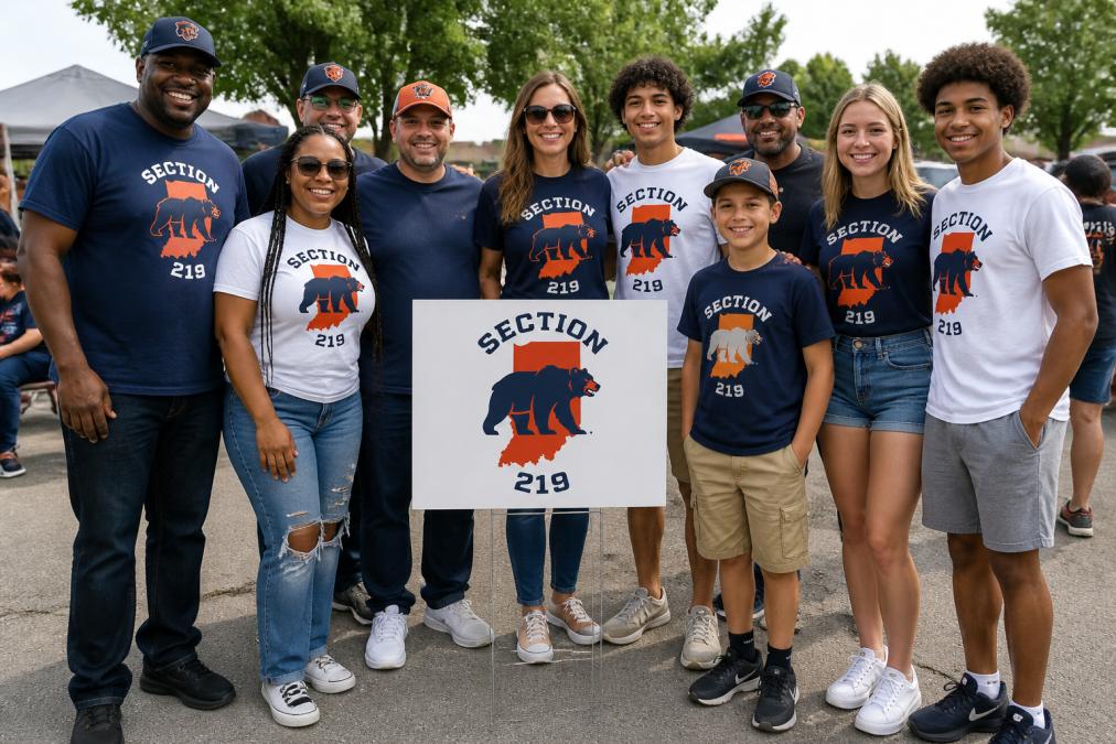 Diverse group of people wearing branded Indiana Bears apparel at a local community gathering, smiling and standing together with genuine connection and shared pride, natural outdoor lighting