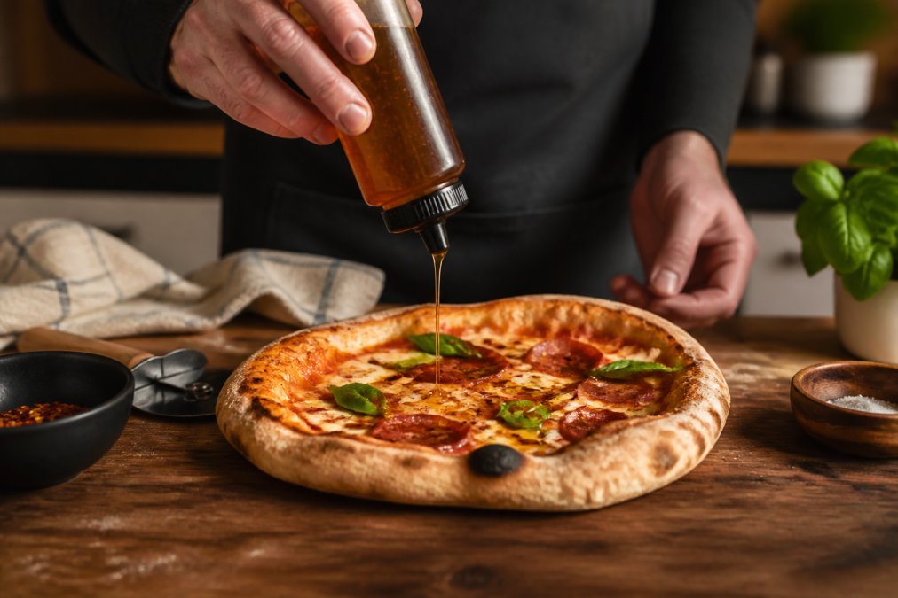 Step-by-step visual guide for Hands for creative ways to use hot honey on pizza