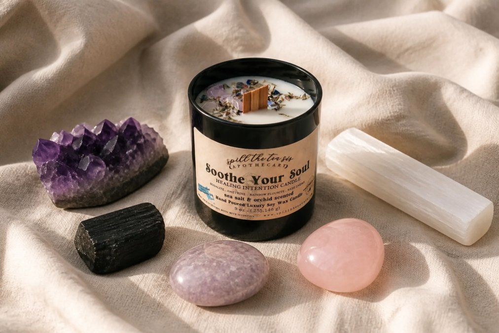 A serene flatlay of polished amethyst, black tourmaline, lepidolite, rose quartz, and selenite crystals arranged on soft cream linen, with warm natural sunlight casting gentle shadows across the stones, highlighting their natural colors and textures