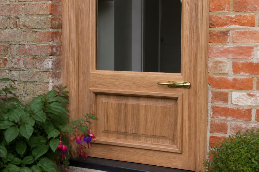 Infographic comparing design features of timber doors and window fittings on a period property exterior