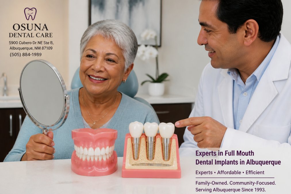 A senior woman smiling confidently while looking in a mirror, with a dentist gently pointing to a dental model in a bright, modern dental office in Albuquerque