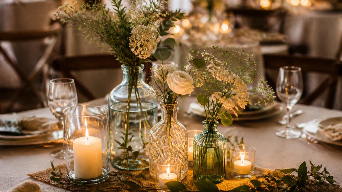 Step-by-step guide for arranging thrifted vases with greenery and flowers for DIY wedding centerpieces