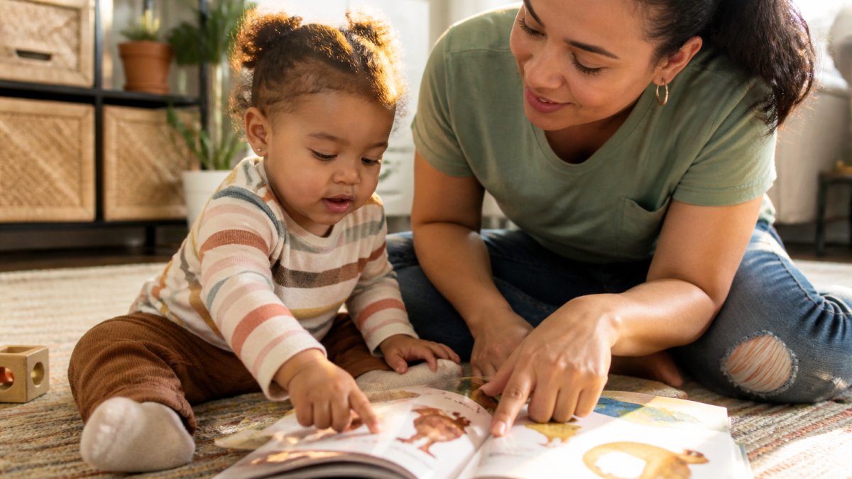 Parent and toddler reading a picture book together to help with language development and does bilingualism cause speech