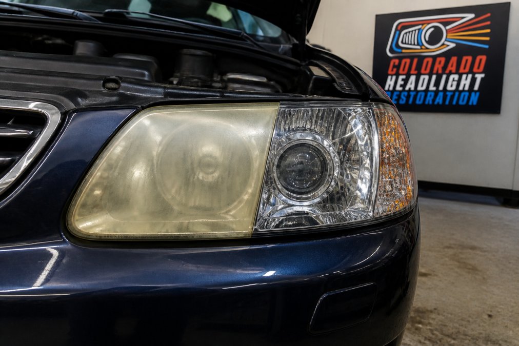 Close-up of a severely yellowed and hazy headlight lens next to a clear, transparent restored lens showing the dramatic difference in clarity, color, and light transmission