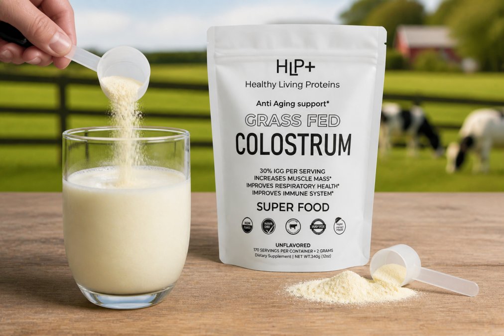 Close-up of a glass of colostrum powder mixed with water, showing the creamy texture with grass-fed dairy imagery softly visible in the background, emphasizing natural supplementation