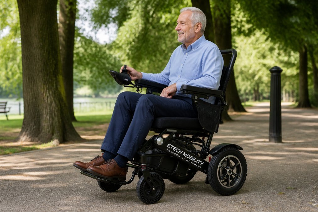 Person with visible hand support using a joystick controller on a powerchair, showing ergonomic grip and intuitive control placement in natural lighting