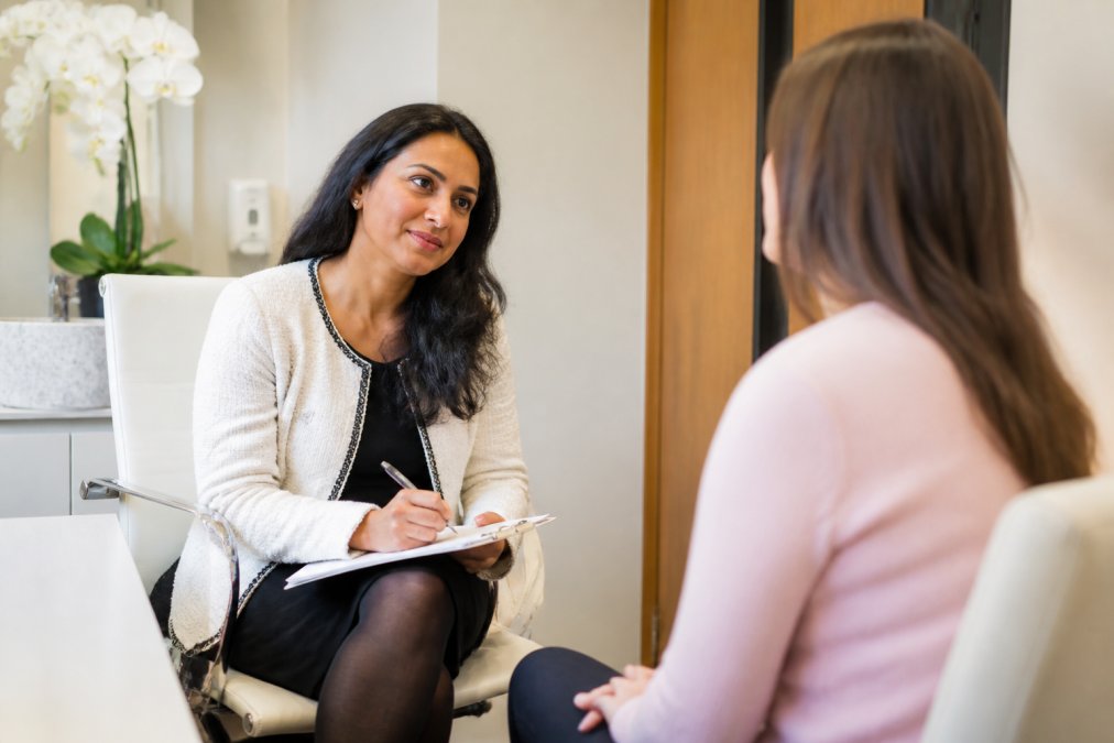 Gynaecological consultant listening to a patient during a consultation to improve endometriosis pain relief quality of life